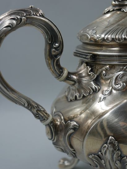 null HENIN ET CIE. Silver tea and coffee set with chased ribs and foliage decoration...
