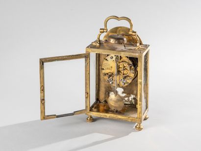 null Gilt bronze alarm clock with flaming quivers, garlands of flowers and leaves....