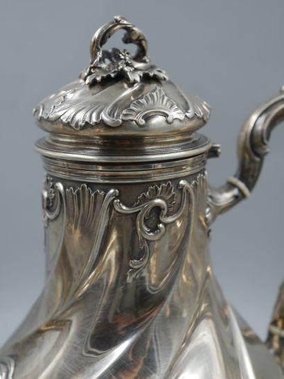 null HENIN ET CIE. Silver tea and coffee set with chased ribs and foliage decoration...