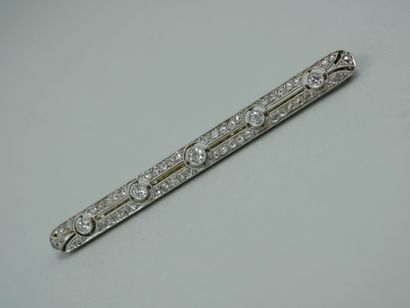 null An 18K white gold openwork barrette brooch set with five brilliant-cut diamonds...