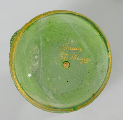 null DAUM Nancy. Toilet bottle in green opacified glass decorated with daisies engraved...