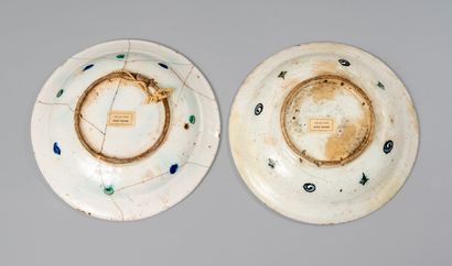 null IZNIK. Two circular siliceous ceramic dishes decorated in polychrome with palms...