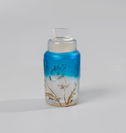 null DAUM. Small bottle of toilet in opaque white glass shaded with blue, strewn...
