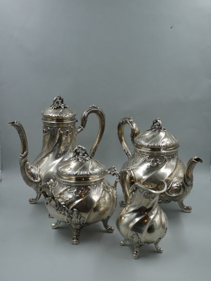 null HENIN ET CIE. Silver tea and coffee set with chased ribs and foliage decoration...