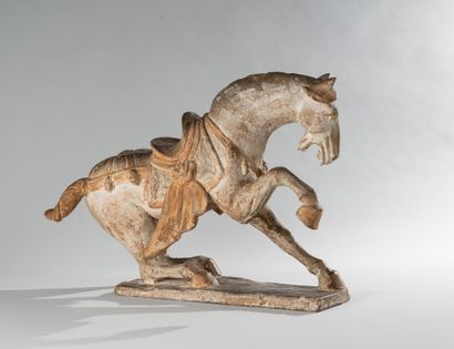 null CHINA, in the Tang style. Semi-sitting horse on a terrace. Terracotta and partial...