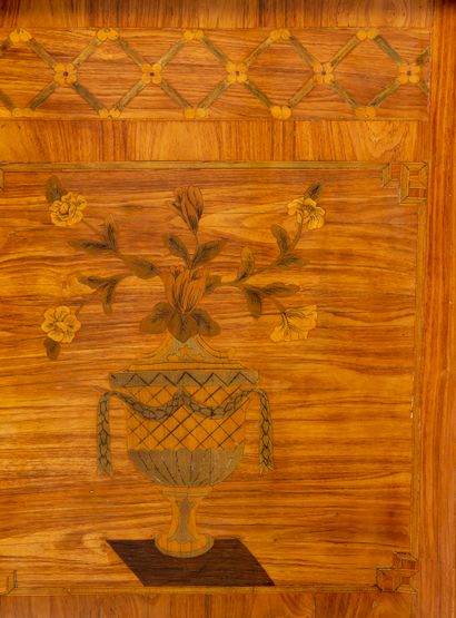 null A double flush chest of drawers made of veneered wood inlaid with flowering...