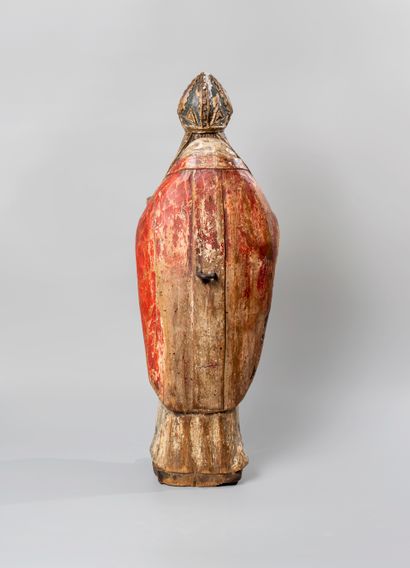 null Polychrome wooden sculpture representing a bishop holding a book in his right...