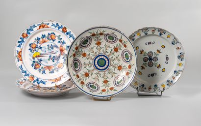 null DELFT. Four earthenware dishes of circular form with polychrome decorations...