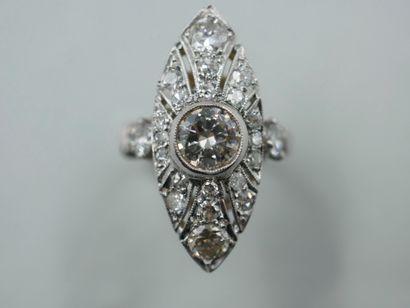 null An 18k white gold openwork marquise ring, set with a central diamond weighing...