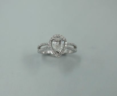 null 18k white gold openwork ring set with a 0.70ct pear-shaped diamond, surrounded...