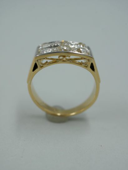 null Band ring in 18k yellow gold and platinum set on two rows of six old cut diamonds...