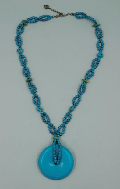 null Turquoise disc Bi pendant held by a chain of turquoise beads alternated with...