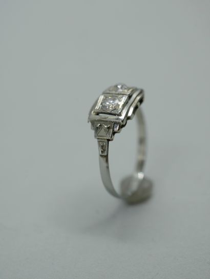 null 18K white gold ring from the Art Deco period set with two old cut diamonds in...
