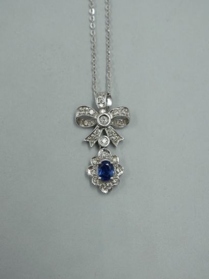 14K white gold pendant with a diamond-paved...