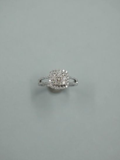 null 18K white gold ring set with a pavement of brilliant-cut diamonds weighing approximately...