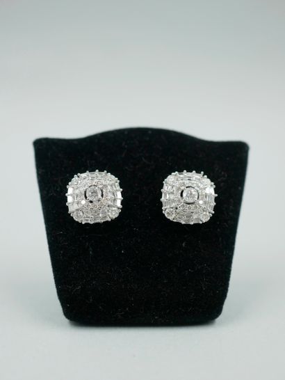 null A pair of 18K white gold square earrings set with a 0.10ct brilliant-cut diamond...