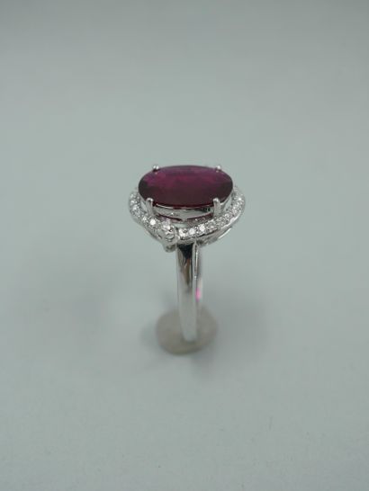 null 18K white gold ring set with a 3.02ct natural oval ruby in a diamond setting...