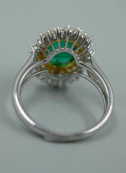 null 18k white and yellow gold skirt ring set with a cabochon emerald weighing approximately...