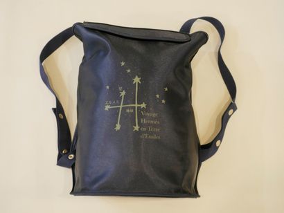 null HERMES Paris. Navy nylon backpack printed "Voyage Hermès en terre d'Etoiles",...