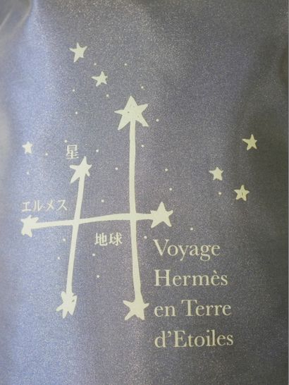 null HERMES Paris. Navy nylon backpack printed "Voyage Hermès en terre d'Etoiles",...