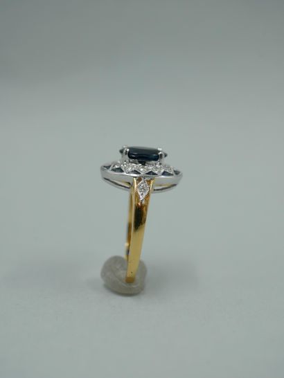 null Art Deco style ring in 18K yellow and white gold set with a natural oval sapphire...