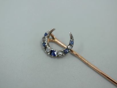 null Tie pin in 18K yellow gold showing a crescent moon set with small rose-cut diamonds...