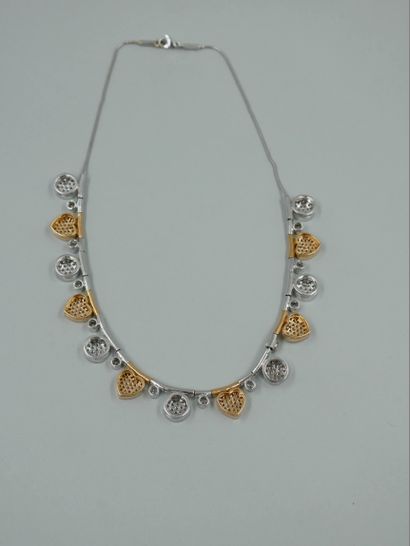 null Necklace in 18k gold of two tones decorated with an alternation of heart and...