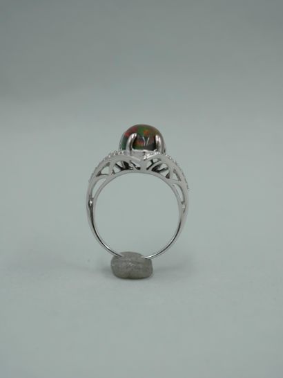 null 18K white gold ring set with a black opal of about 3cts cut in a piriform cabochon...