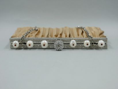 null VALENTINO. Evening minaudiere in cream pleated silk. The clasp is paved with...