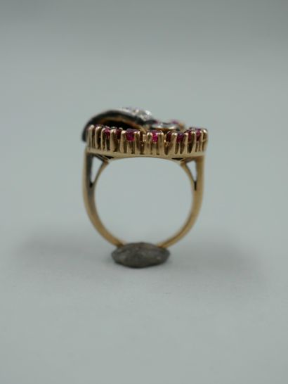 null A 14k yellow and white gold nautilus ring set with old cut diamonds and rubies....