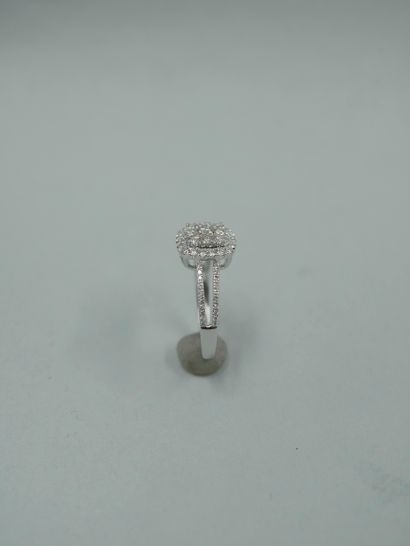 null 18K white gold ring set with a pavement of brilliant-cut diamonds weighing approximately...