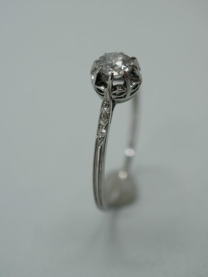 null Solitaire ring in platinum set with an old cut diamond set 8 claws in an openwork...
