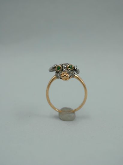null Ring in 18K two-tone gold with a ram's head paved with diamonds, the eyes set...