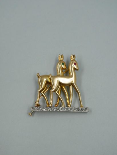 null 18K yellow gold and platinum brooch representing two deer, their eyes set with...