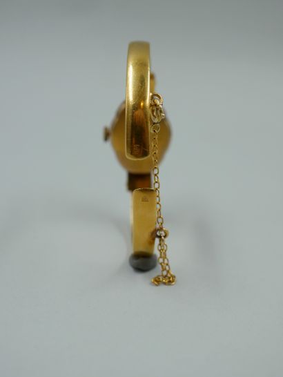 null DAMY. Lady's wristwatch in gilt metal, the dial with a window hidden by a faceted...