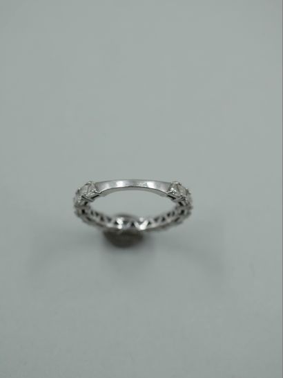 null American half wedding ring in 18k white gold set with trillion cut diamonds...
