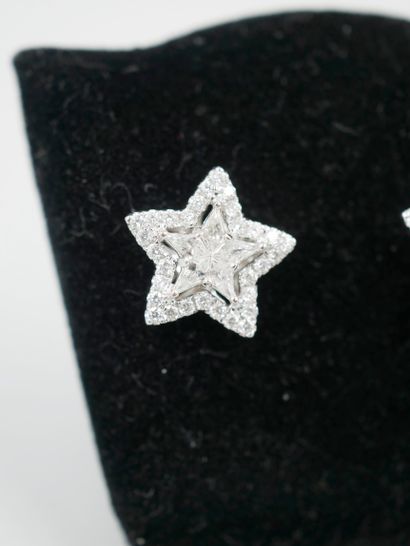 null Pair of 18K white gold star earrings set in their centers with two stars composed...