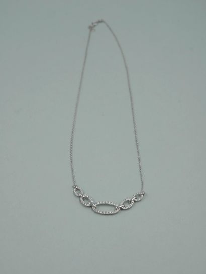 null Necklace in 18K white gold with five oblong links paved with diamonds, the center...