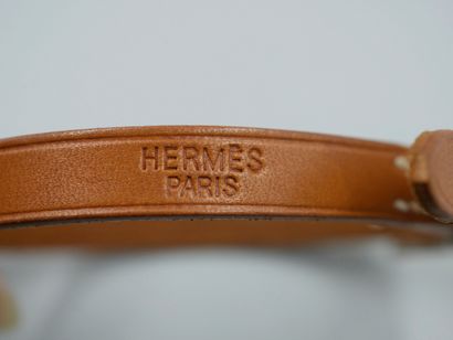 null HERMES Paris. Hapi" bracelet in light brown leather, metal clasp. Length 22...
