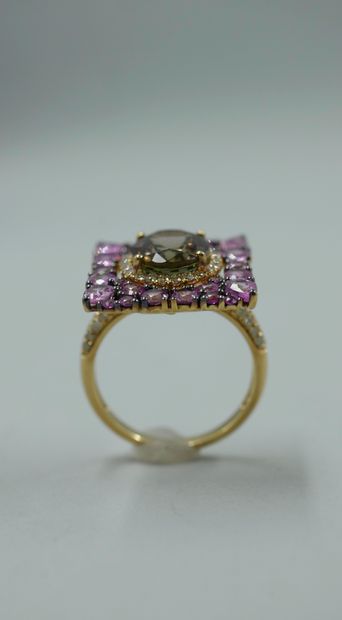 null 18k yellow gold ring set with an oval tourmaline weighing about 3cts set with...