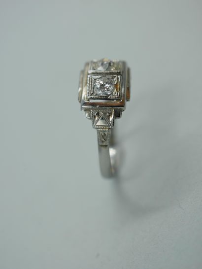 null 18K white gold ring from the Art Deco period set with two old cut diamonds in...