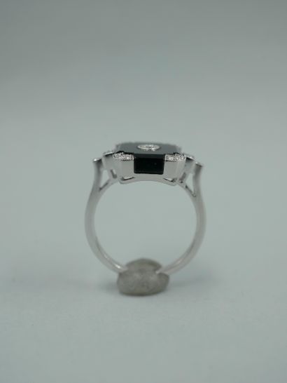 null Art Deco style ring in 18K white gold set with an onyx plaque centered and shouldered...