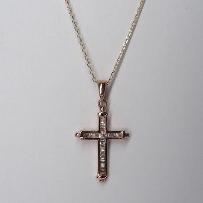 null Cross pendant in 18K pink gold set in its center with a brilliant-cut diamond...