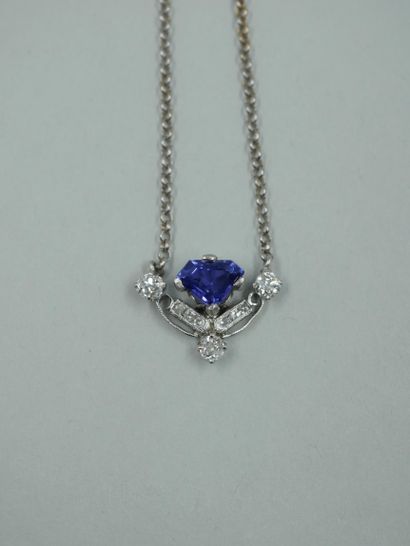 null Stylized Saint Esprit pendant in 18K white gold, composed of a triangular sapphire...