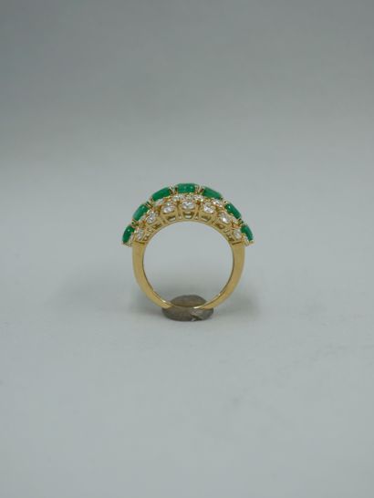 null 18k yellow gold openwork band ring set with seven oval emeralds surrounded by...