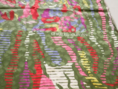 null Charles JOURDAN. Large silk scarf with colored patterns on a green background...
