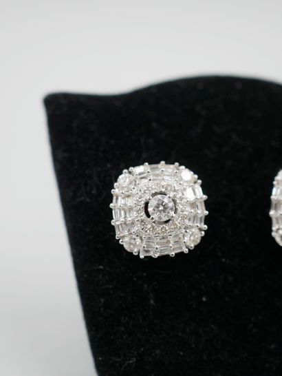 null A pair of 18K white gold square earrings set with a 0.10ct brilliant-cut diamond...