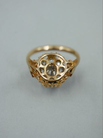 null 18k yellow gold flower ring paved with old cut cushion diamonds, the center...