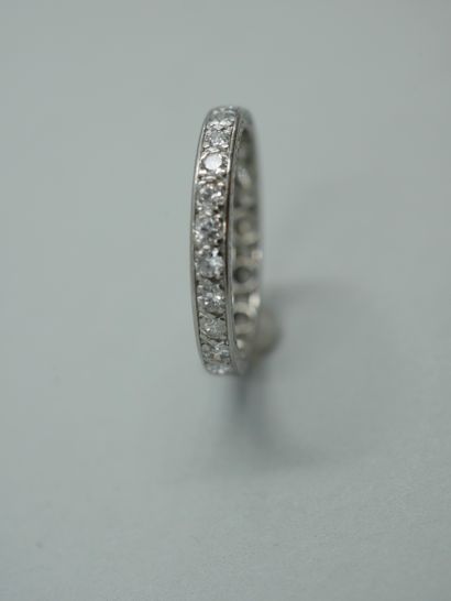 null American wedding ring in platinum set with twenty-five old cut diamonds, the...