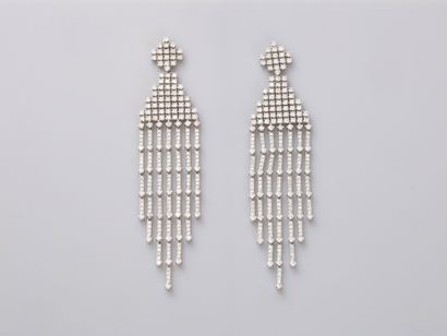 null A pair of 18k white gold passementerie earrings set with brilliant-cut diamonds....